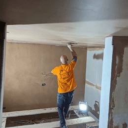 Experienced Plasterer In Action